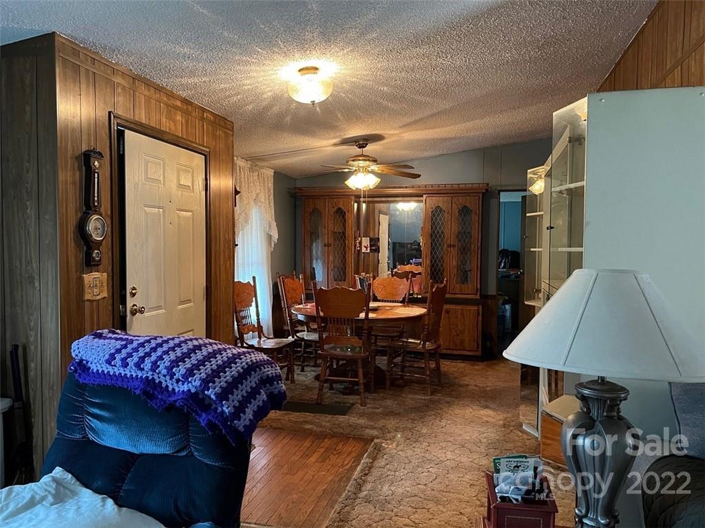 396 Jacobs Road Bryson City, NC 28713 - Photo 13 of 43 a living room with furniture a lamp and a window