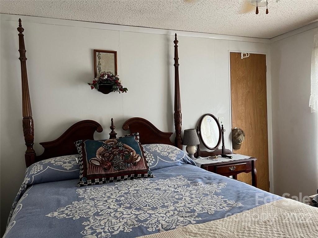 396 Jacobs Road Bryson City, NC 28713 - Photo 16 of 43 a bedroom with a bed and dresser