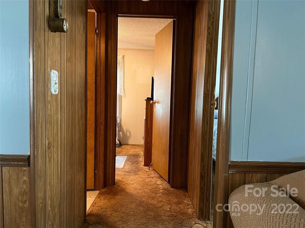 396 Jacobs Road Bryson City, NC 28713 - Photo 18 of 43 a view of a bedroom with a bed and a hallway
