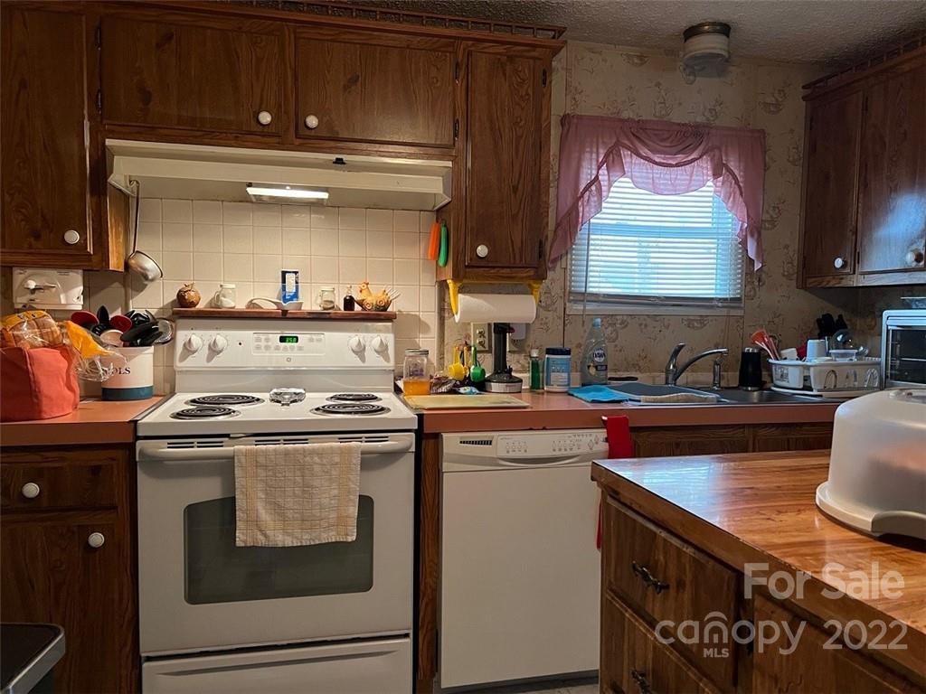 396 Jacobs Road Bryson City, NC 28713 - Photo 19 of 43 a kitchen with a stove and a sink
