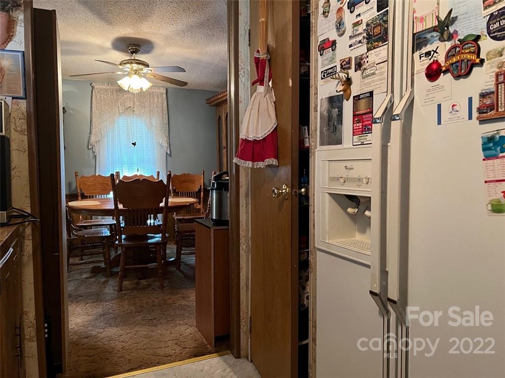 396 Jacobs Road Bryson City, NC 28713 - Photo 23 of 43 a dining room with furniture and a chandelier fan