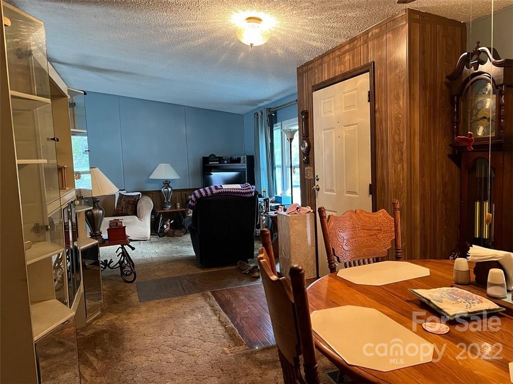 396 Jacobs Road Bryson City, NC 28713 - Photo 24 of 43 a bed room with furniture a rug and a large window