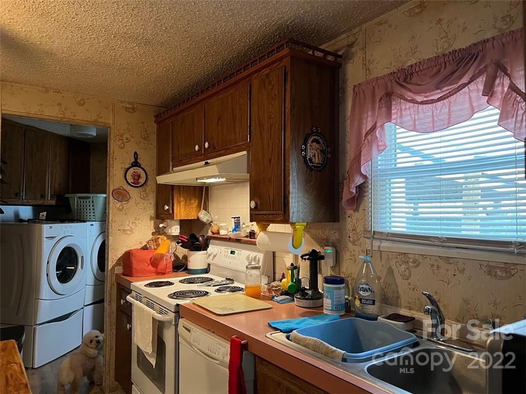 396 Jacobs Road Bryson City, NC 28713 - Photo 25 of 43 a kitchen with lots of appliances and cabinets