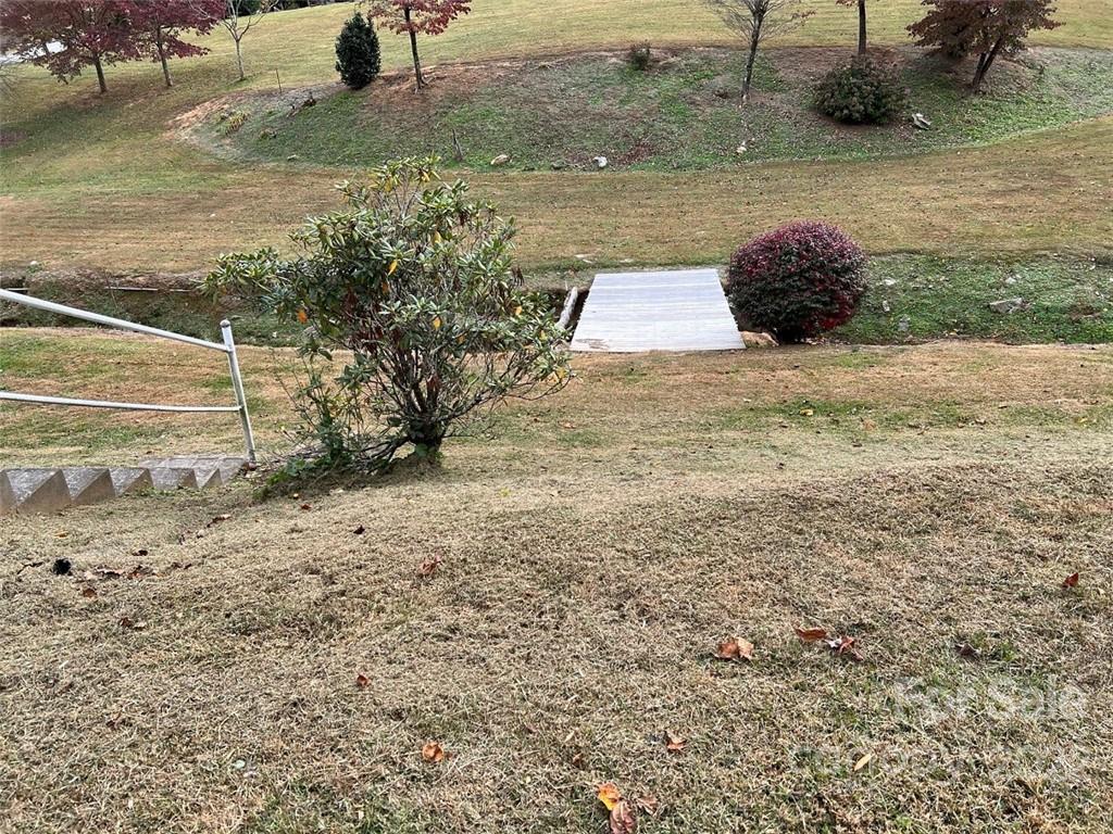 396 Jacobs Road Bryson City, NC 28713 - Photo 32 of 43 a view of a dry yard with wooden fence