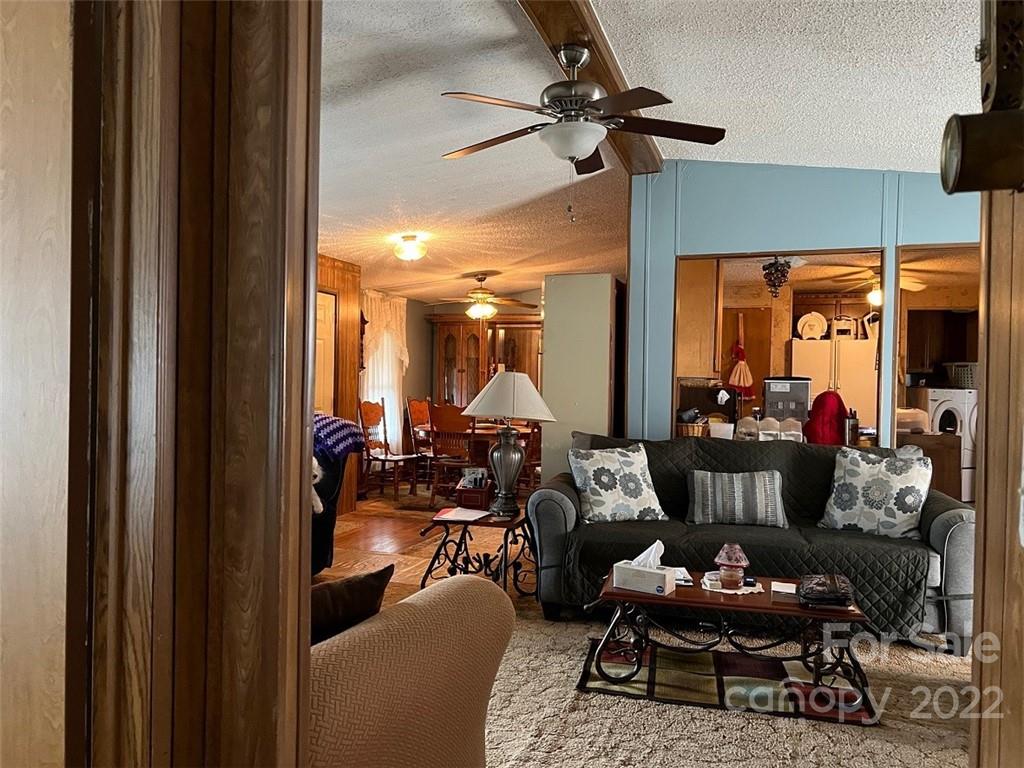 396 Jacobs Road Bryson City, NC 28713 - Photo 9 of 43 a living room with furniture and a chandelier