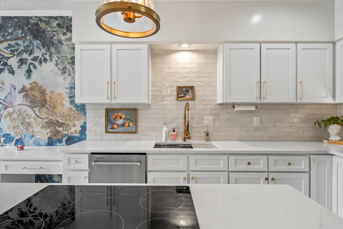 8417 Bazemore Road Memphis, TN 38018 - Photo 15 of 39 a kitchen with stainless steel appliances granite countertop a sink and a stove