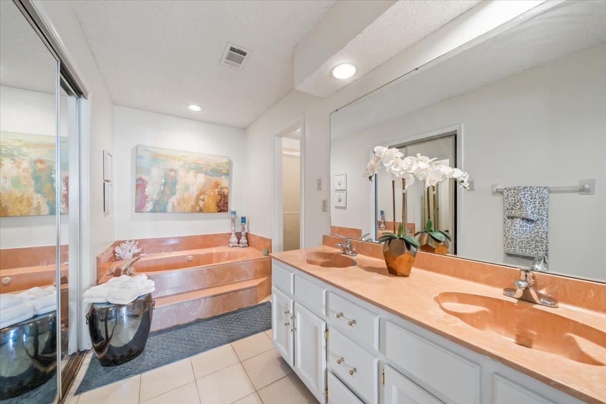 8417 Bazemore Road Memphis, TN 38018 - Photo 20 of 39 a bathroom with a tub sink and mirror