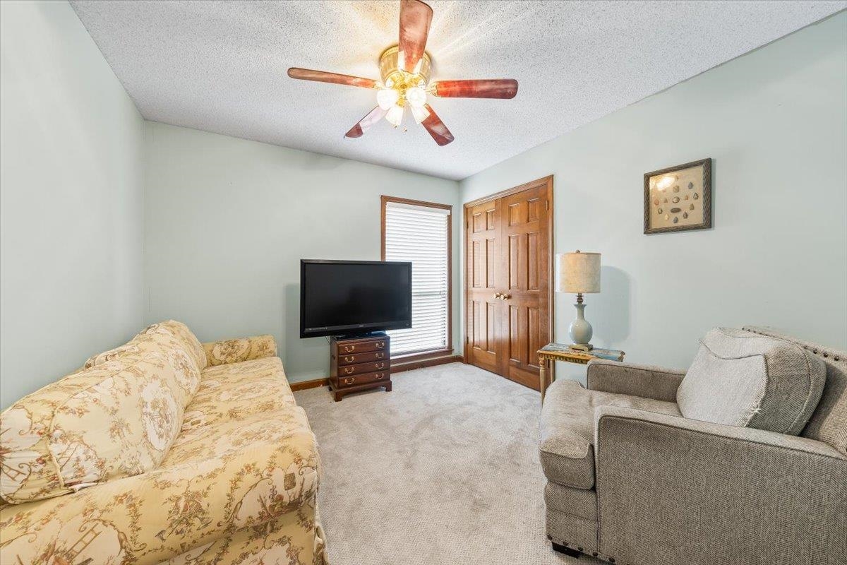 8417 Bazemore Road Memphis, TN 38018 - Photo 23 of 39 a living room with furniture and a flat screen tv