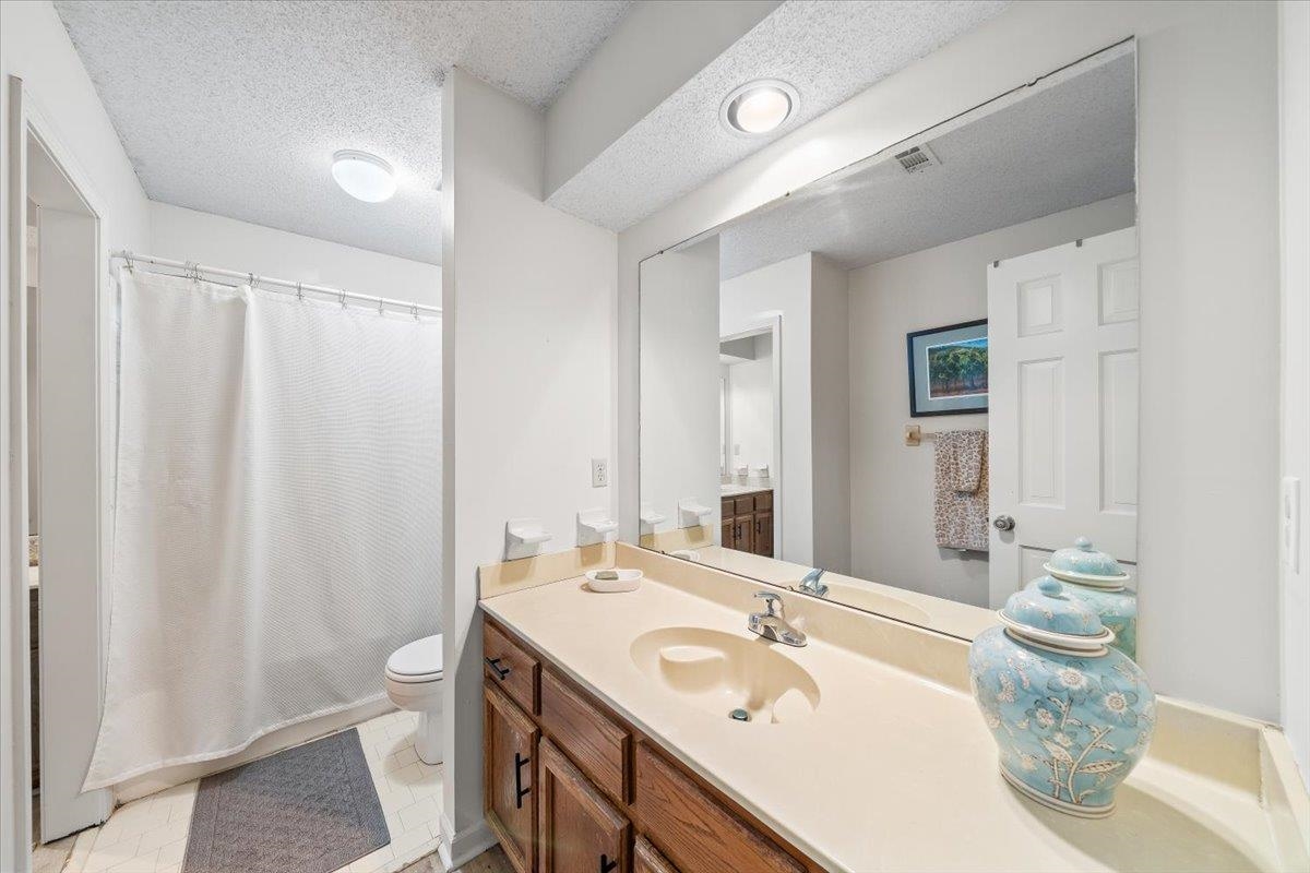 8417 Bazemore Road Memphis, TN 38018 - Photo 24 of 39 a bathroom with a double vanity sink and a mirror