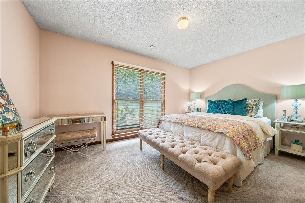 8417 Bazemore Road Memphis, TN 38018 - Photo 25 of 39 a bedroom with a bed and a couch