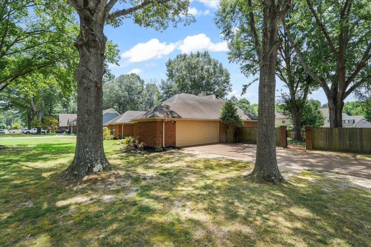 8417 Bazemore Road Memphis, TN 38018 - Photo 33 of 39 a view of a house with yard and garage