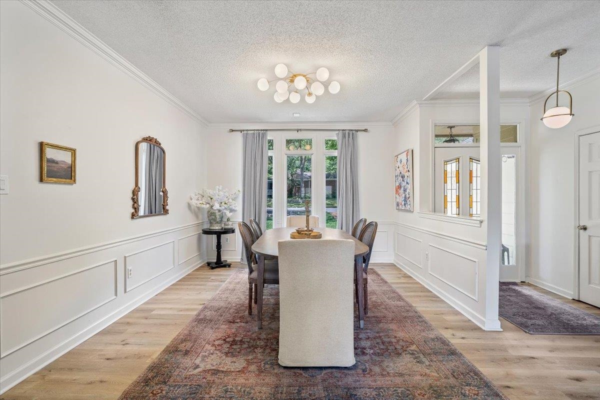 8417 Bazemore Road Memphis, TN 38018 - Photo 4 of 39 a dining room with furniture a chandelier and wooden floor