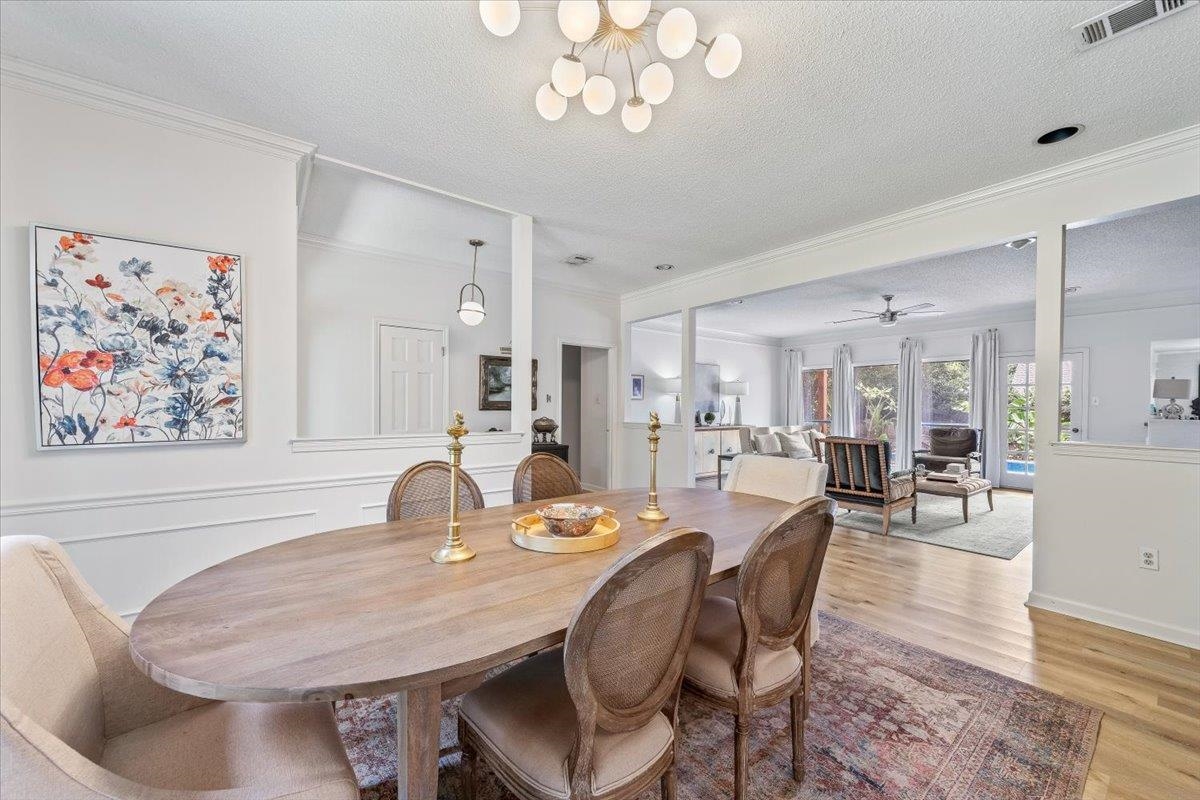 8417 Bazemore Road Memphis, TN 38018 - Photo 5 of 39 a dining room with wooden floor and chandelier