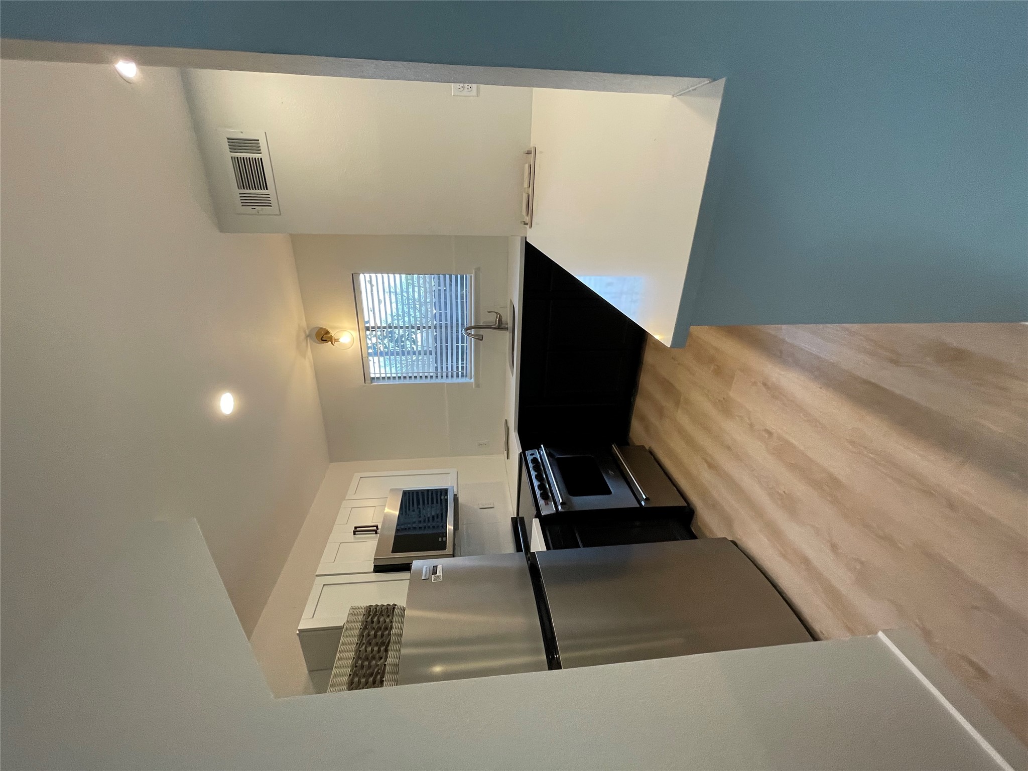 1714 Enfield Road, Unit 102 Austin, TX 78703 - Photo 5 of 15 Kitchen with sleek appliances and a practical layout awaits inspired culinary creations.