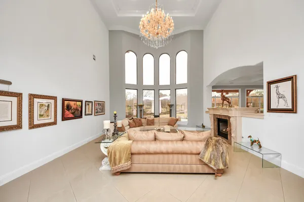 a view of living room with furniture and a chandelier