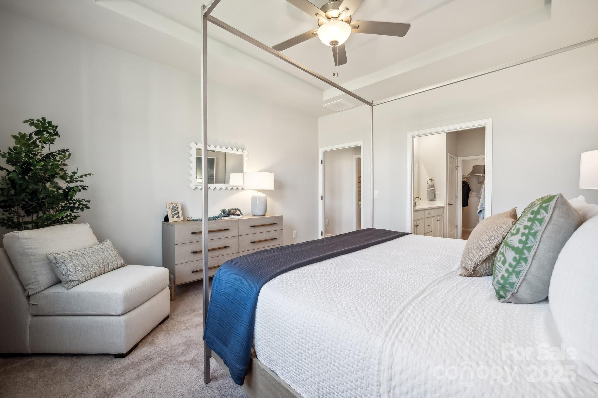 6417 Alanbrook Road, Unit 6 Charlotte, NC 28215 - Photo 17 of 25 a bedroom with a bed couch and chandelier