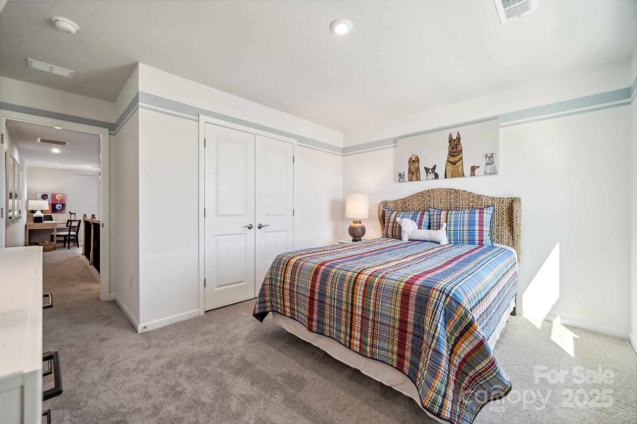 6417 Alanbrook Road, Unit 6 Charlotte, NC 28215 - Photo 23 of 25 a bedroom with a bed and a view of kitchen