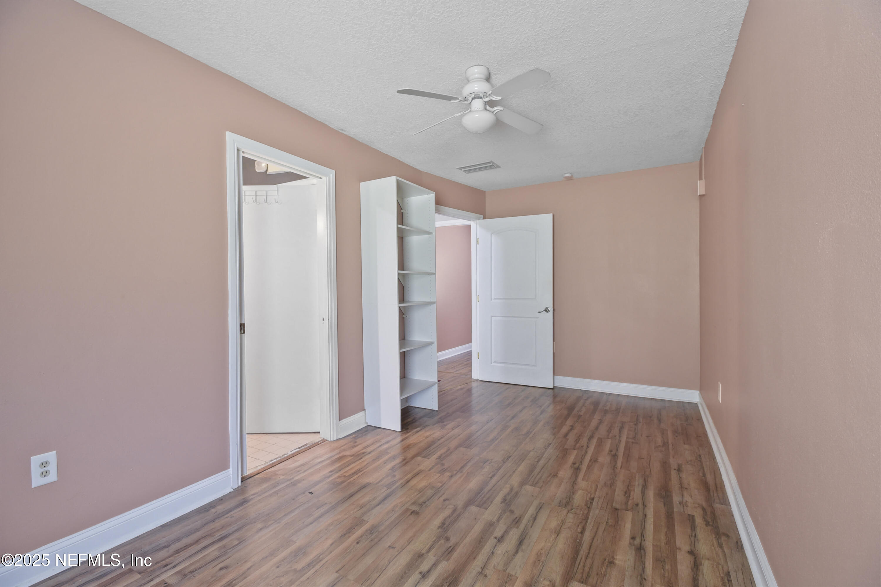 2706 Old Moultrie Road St. Augustine, FL 32086 - Photo 10 of 31 a view of an empty room with wooden floor