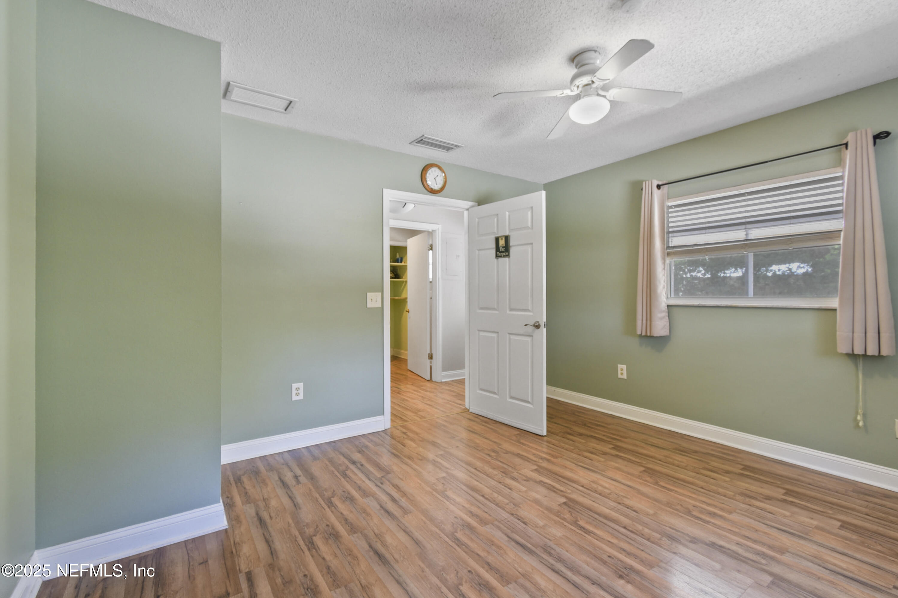 2706 Old Moultrie Road St. Augustine, FL 32086 - Photo 17 of 31 wooden floor in an empty room with a window