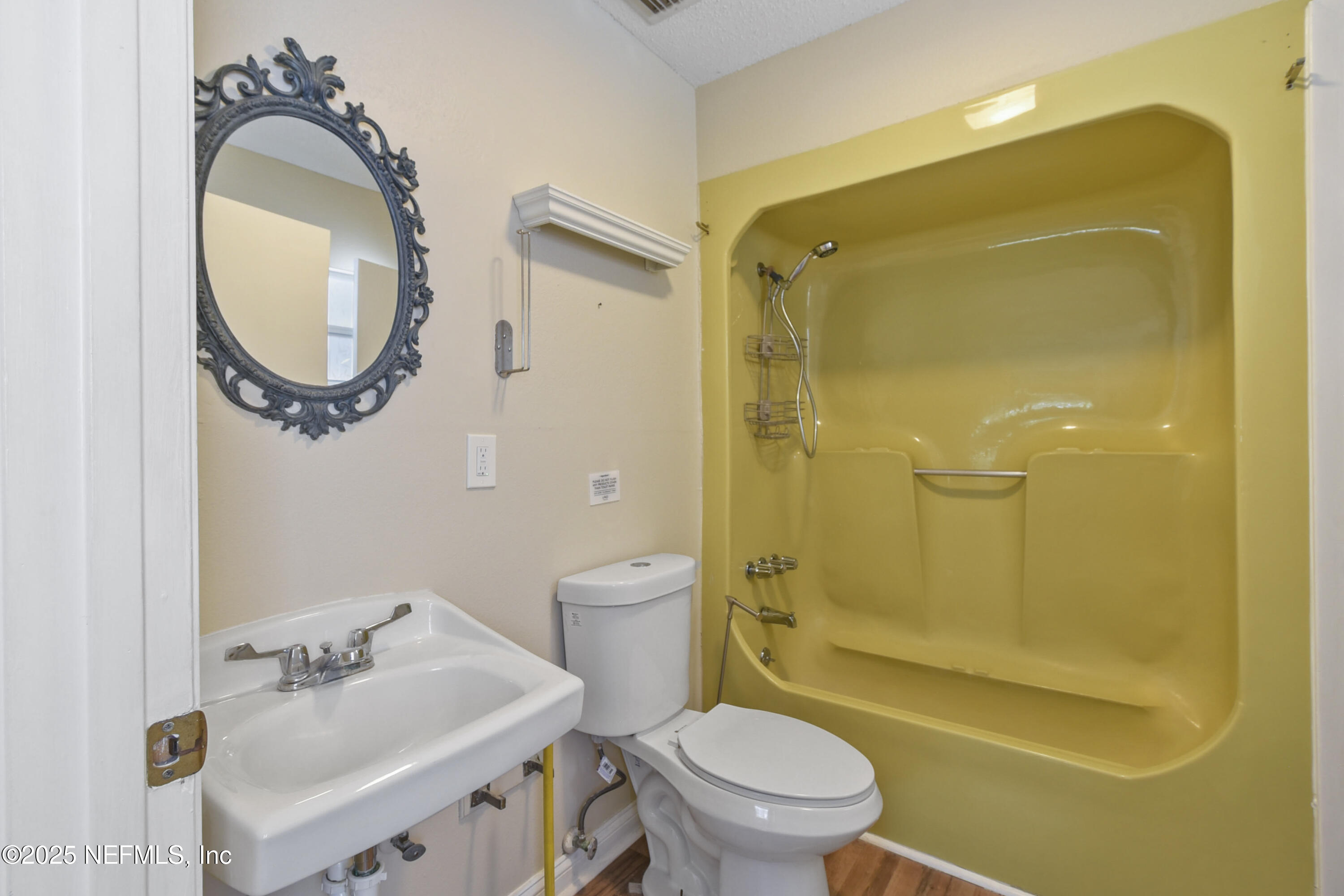 2706 Old Moultrie Road St. Augustine, FL 32086 - Photo 18 of 31 a bathroom with a sink a toilet and shower