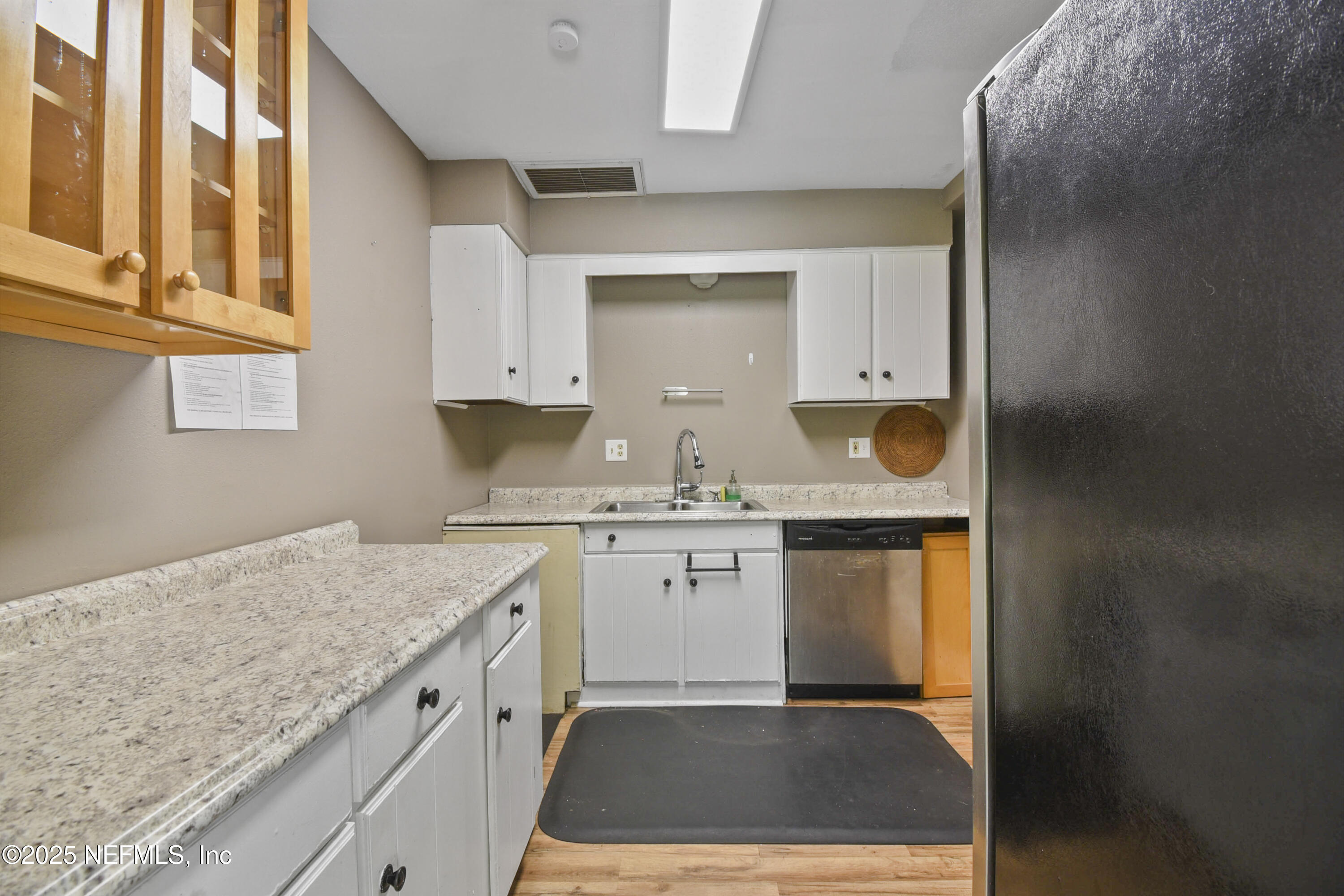 2706 Old Moultrie Road St. Augustine, FL 32086 - Photo 20 of 31 a kitchen with granite countertop cabinets stainless steel appliances and a counter tops