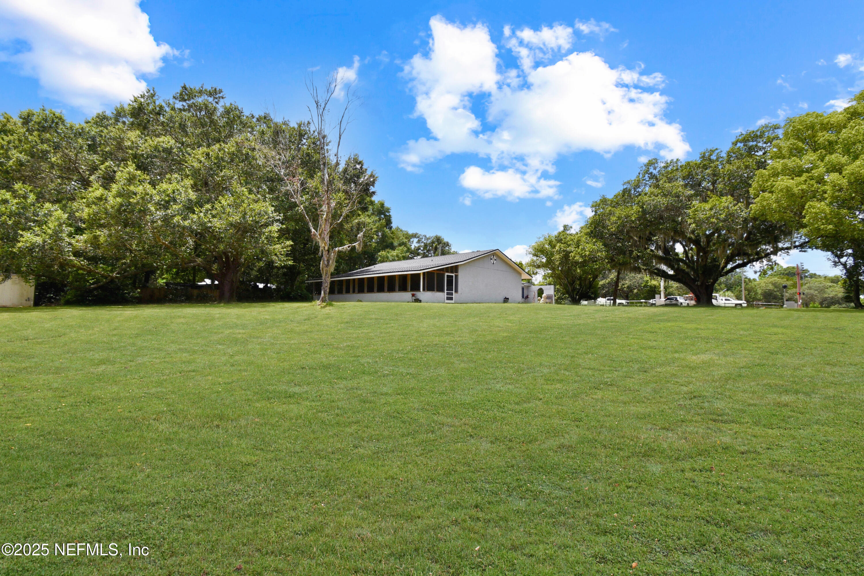 2706 Old Moultrie Road St. Augustine, FL 32086 - Photo 25 of 31 a view of green field with tree in the background