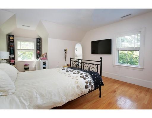 145 Middlesex Road Brookline, MA 02467 - Photo 11 of 25 a bedroom with a bed and a flat screen tv