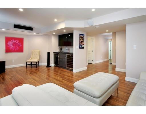 145 Middlesex Road Brookline, MA 02467 - Photo 14 of 25 a living room with furniture and a flat screen tv