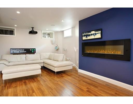 145 Middlesex Road Brookline, MA 02467 - Photo 15 of 25 a living room with furniture and a flat screen tv