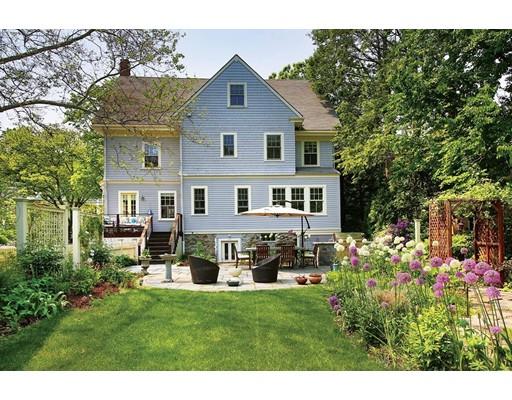 145 Middlesex Road Brookline, MA 02467 - Photo 16 of 25 a front view of a house with a garden and sitting area