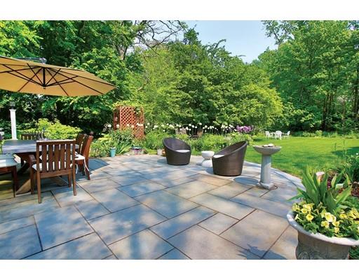 145 Middlesex Road Brookline, MA 02467 - Photo 18 of 25 a view of a chair and table in backyard