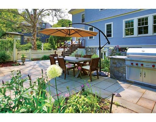 145 Middlesex Road Brookline, MA 02467 - Photo 19 of 25 a view of a patio with table and chairs under an umbrella
