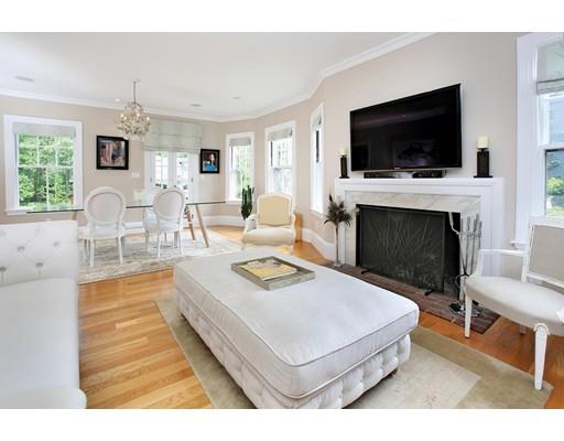 145 Middlesex Road Brookline, MA 02467 - Photo 3 of 25 a living room with furniture and a flat screen tv