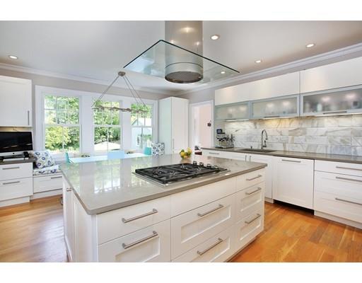 145 Middlesex Road Brookline, MA 02467 - Photo 4 of 25 a kitchen with stainless steel appliances granite countertop a sink window and cabinets