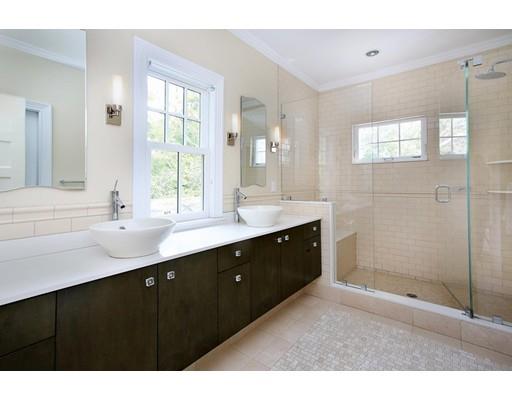 145 Middlesex Road Brookline, MA 02467 - Photo 9 of 25 a bathroom with a sink double vanity and a mirror