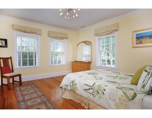 145 Middlesex Road Brookline, MA 02467 - Photo 10 of 25 a bedroom with a bed and wooden floor