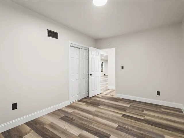 a view of a livingroom with wooden floor