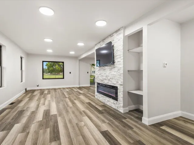 a view of kitchen with sink and refrigerator