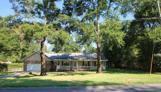 223 Ridge Lake Road Crestview, FL 32536 - Photo 1 of 40 a front view of house with yard and green space