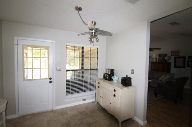 223 Ridge Lake Road Crestview, FL 32536 - Photo 16 of 40 a room with a white bed and a window