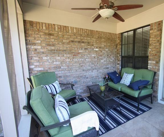 223 Ridge Lake Road Crestview, FL 32536 - Photo 21 of 40 a outdoor living space with furniture and a floor to ceiling window