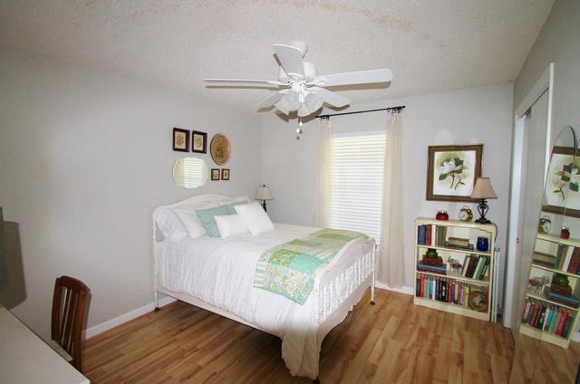 223 Ridge Lake Road Crestview, FL 32536 - Photo 28 of 40 a bedroom with a bed and a book shelf