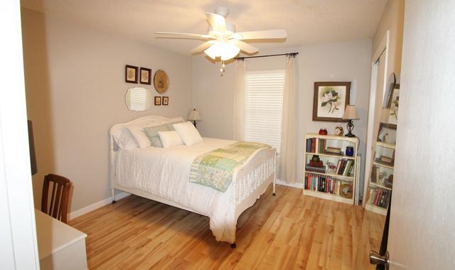 223 Ridge Lake Road Crestview, FL 32536 - Photo 32 of 40 a bedroom with a bed and a large mirror on the dresser