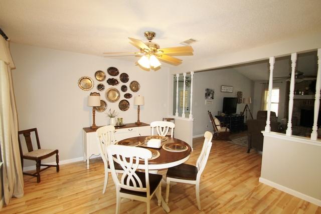 223 Ridge Lake Road Crestview, FL 32536 - Photo 35 of 40 a view of a dining room with furniture and wooden floor
