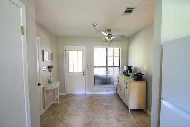 223 Ridge Lake Road Crestview, FL 32536 - Photo 36 of 40 a view of a room with window and hardwood floor