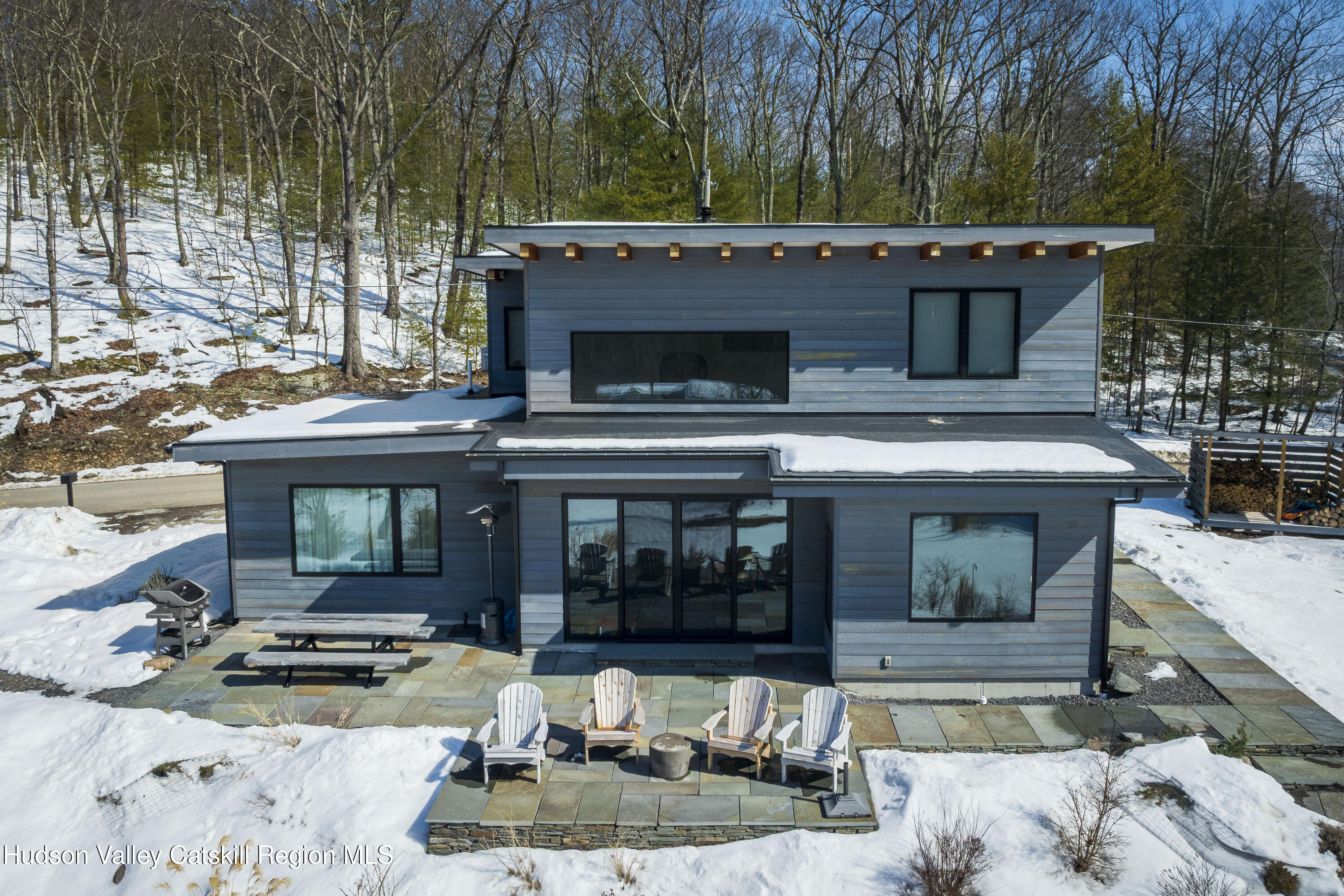 a view of a house with backyard outdoor seating and kitchen view