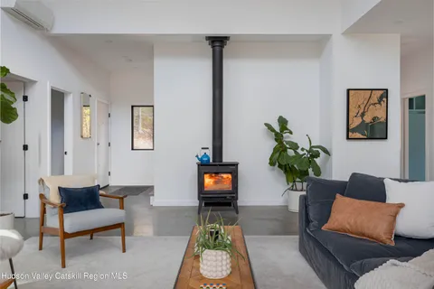 a living room with furniture and a lamp