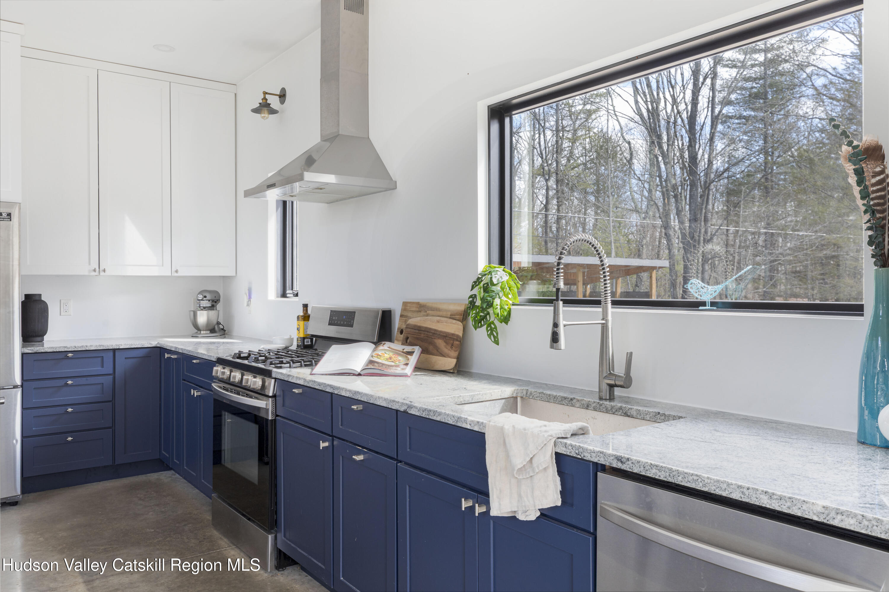 23 Traver Hollow Road Boiceville, NY 12412 - Photo 17 of 48 a kitchen with stainless steel appliances granite countertop a sink a stove and a wooden cabinets