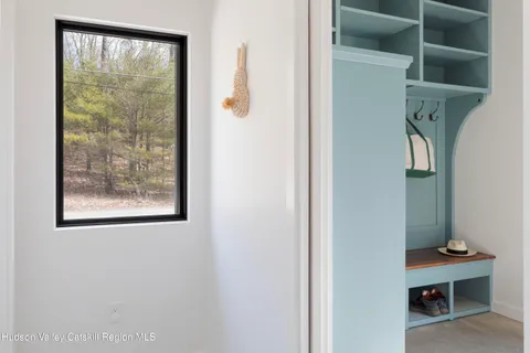 a view of a small space with racks on the wall