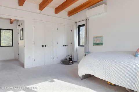 a bed room with a bed and a window